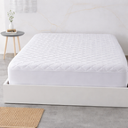 Cubre colchón protector de colchón acolchado reversible y transpirable.